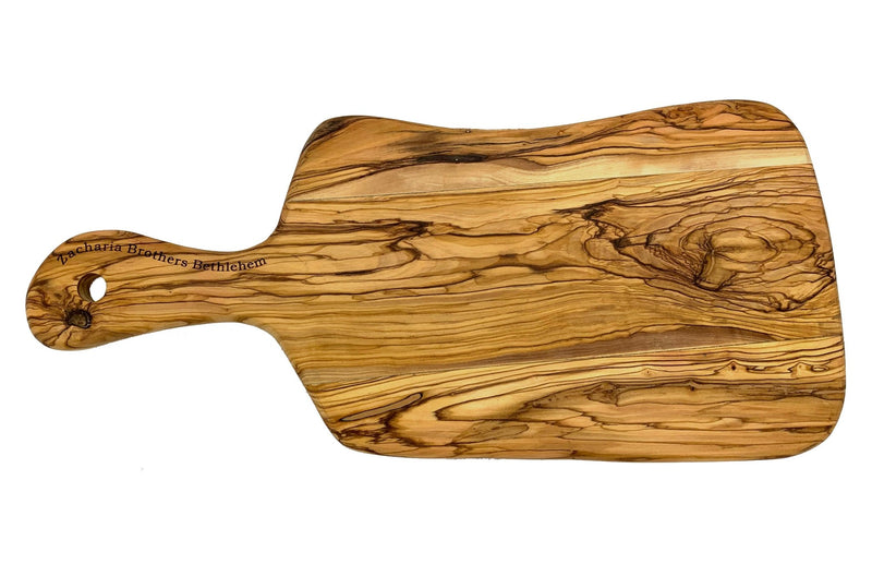 https://www.shenandoahhomesteadsupply.com/cdn/shop/products/olive-wood-paddle-handle-cutting-boards-including-oil-made-in-bethlehem-746889_800x.jpg?v=1697819137